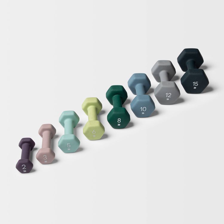 A set of eight hexagonal dumbbells in various colors, each labeled with weights ranging from 2 to 15.