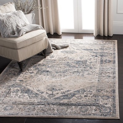 Ivory and Blue 10' x 14' Synthetic Stain-Resistant Rectangular Area Rug