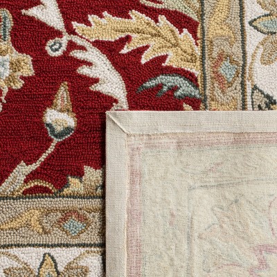 Red and Ivory Hand-Hooked Synthetic 6' x 9' Area Rug