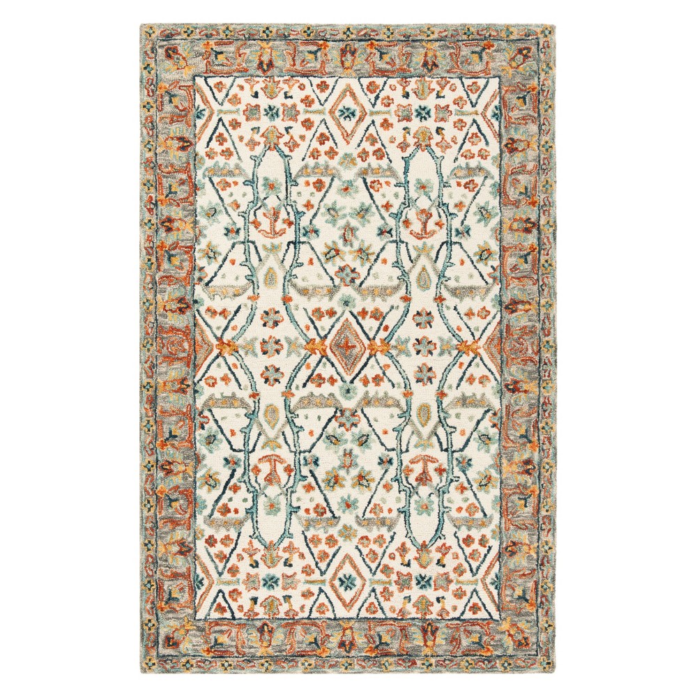 5'X8' Floral Tufted Area Rug Ivory/Blue - Safavieh