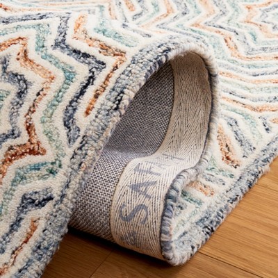 Capri Blue and Rust Hand-Tufted Wool Area Rug 6' x 9'