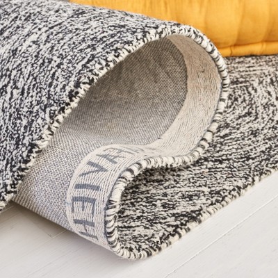 Handmade Black and Ivory Wool Tufted Area Rug, 5' x 8'