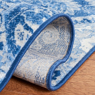 Handmade Round Blue and Ivory Synthetic Area Rug, 4'x6'