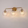 DORESshop25 in. 3-Light Gold Vanity Wall Light with Clear Globe Glass Shades, Modern Bathroom Fixture, Up/Down Mount, E26 Base - 2 of 4
