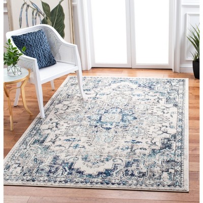 Ivory and Grey Synthetic 6' x 9' Distressed Medallion Area Rug