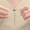 Perfect for teens and young adults, this White Gold-Plated Adjustable Bracelet features a ribbon wrapped around a heart for a meaningful touch. - 3 of 4