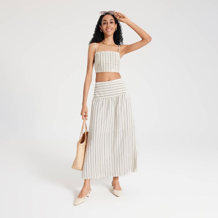 A beige colored ankle-length skirt with vertical stripes.