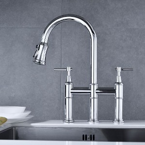Kitchen Elegance Enhanced by a Polished Bridge Faucet with Pull-Down Spray - 1 of 4