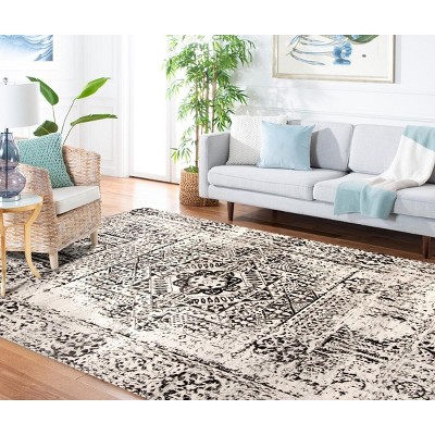 Ivory and Black Floral Motif Synthetic Area Rug