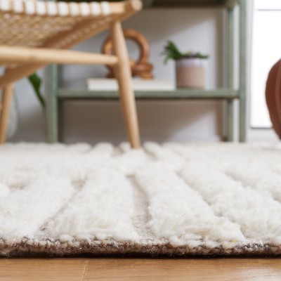 Ivory and Beige 8' x 10' Handmade Wool and Cotton Area Rug