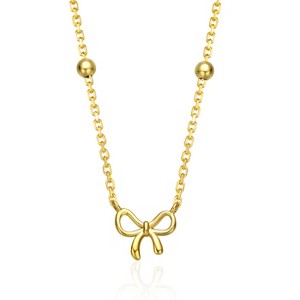 Guili Kids? 14K Yellow Gold Plated Ribbon Necklace, a charming and delicate bow design, bringing playful elegance to any young fashionista. - 1 of 2