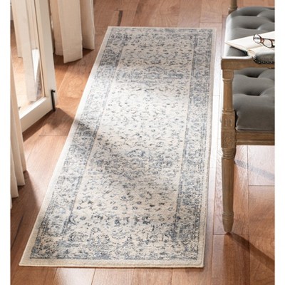 Ivory and Navy Synthetic 2' x 6' Runner Rug