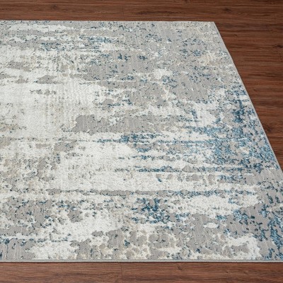 Blue and Ivory Abstract 9' x 12' Synthetic Area Rug