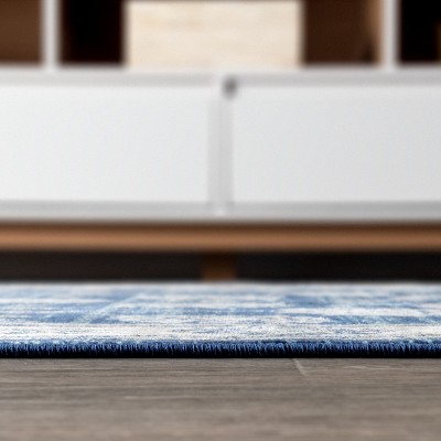 Ivory and Blue Floral Synthetic 4' x 6' Area Rug