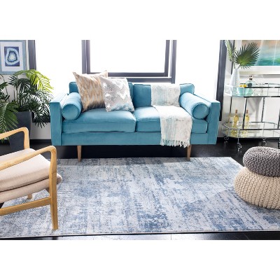 Ivory & Blue Synthetic Easy-Care 5'3" x 7'6" Area Rug