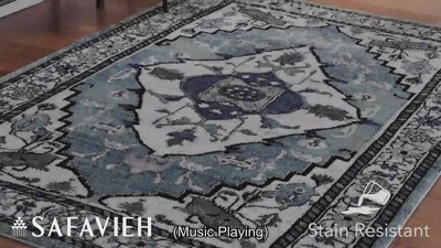 Blue and Ivory Synthetic Persian Area Rug, 5'3" x 7'6"