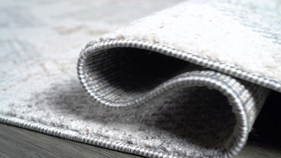 Bhalil 5' x 8' Gray and Beige Geometric Area Rug