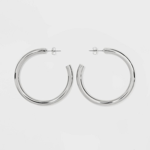 Elsa Peretti® Open Heart hoop earrings in sterling silver. More