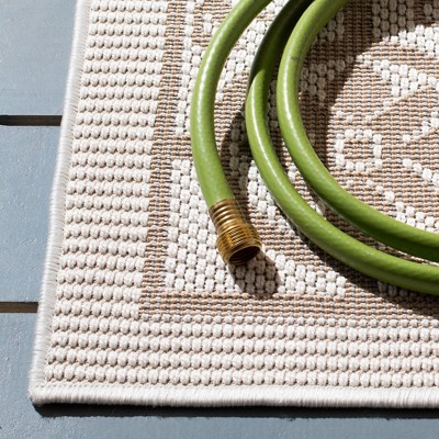 Ivory and Beige Geometric Synthetic Indoor/Outdoor Area Rug