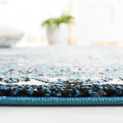 Vintage Blue and Ivory Synthetic 8' x 10' Hand-Knotted Area Rug