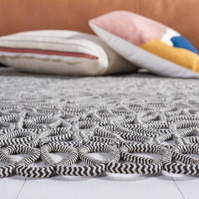 Hand-Knotted Black Synthetic Rectangular 4' x 6' Rug