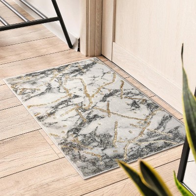 Ivory 5' x 7' Abstract Stain-Resistant Synthetic Area Rug