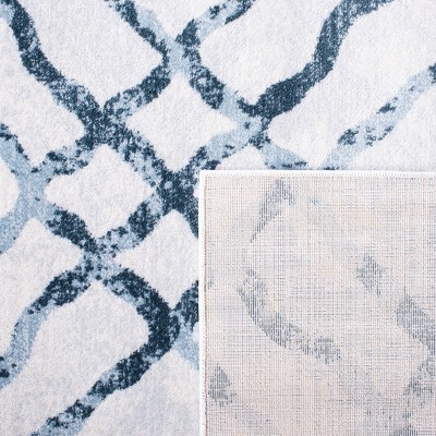 Ivory and Turquoise Geometric Tufted Wool Area Rug