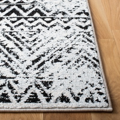 Ivory and Charcoal Geometric 9' x 12' Synthetic Area Rug