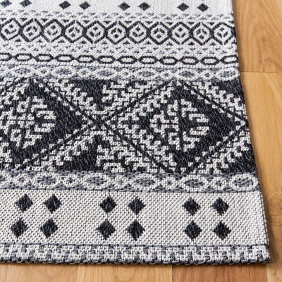Augustine Black and Cream Geometric Flat Woven Area Rug
