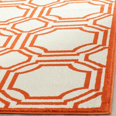 Ivory and Orange Geometric Synthetic Area Rug