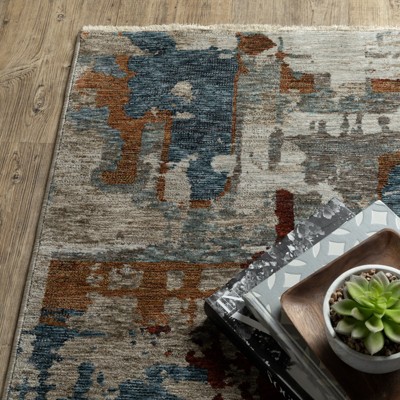 6.7x9.6 Blue and Beige Abstract Synthetic Area Rug