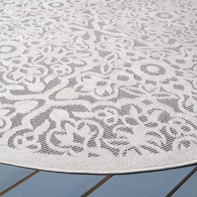 Ivory and Grey Round Geometric Synthetic Indoor/Outdoor Rug
