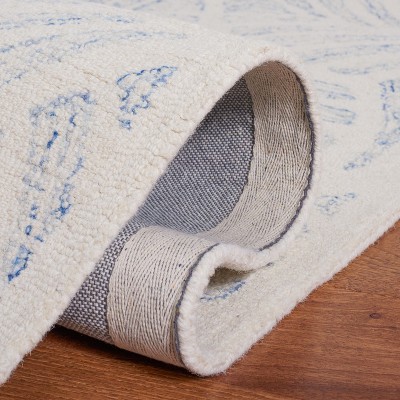 Ivory and Blue Handmade Wool Tufted 8' x 10' Area Rug