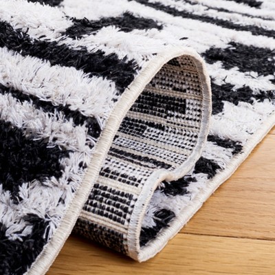 Augustine Black and Ivory Flat Woven Synthetic Area Rug