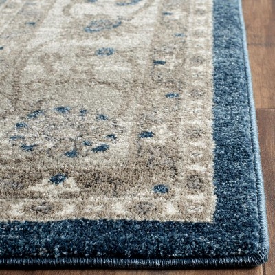 Navy and Beige Floral Border Synthetic Area Rug 8' x 10'