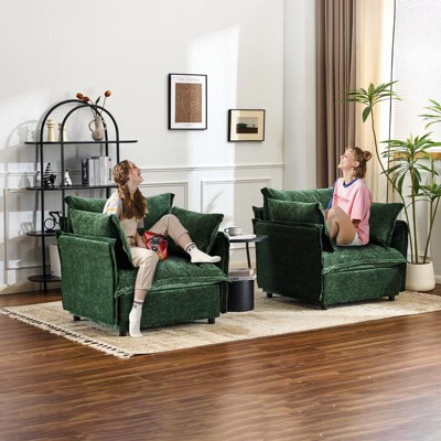 Two green upholstered armchairs with matching cushions in a living room