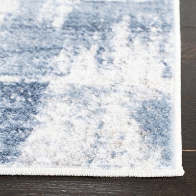 Ivory and Blue Abstract Synthetic Round Area Rug, 54"