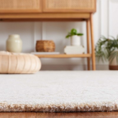 Ivory Hand Tufted Wool Rectangular 8' x 10' Area Rug