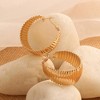 SOHI Women's Gold Ripple Hoop Earrings - 2 of 3