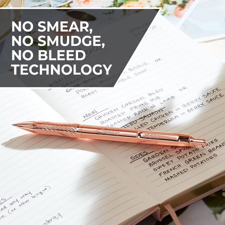 A rose gold colored pen with "Sharpie S-Gel" engraved on it, placed on an open notebook with handwritten notes, alongside text stating "NO SMEAR, NO SMUDGE, NO BLEED TECHNOLOGY."