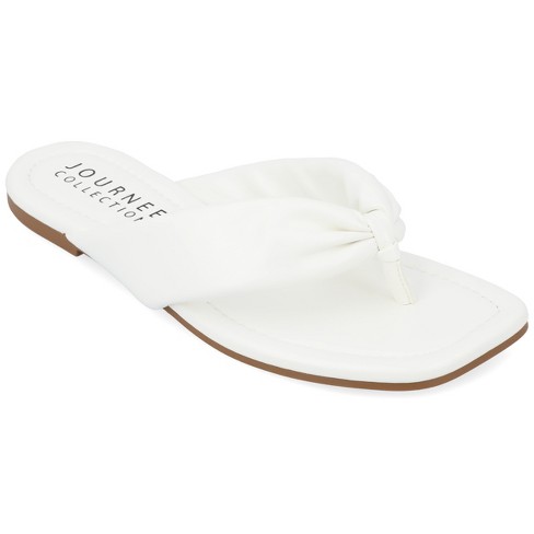 White flip flops target new arrivals