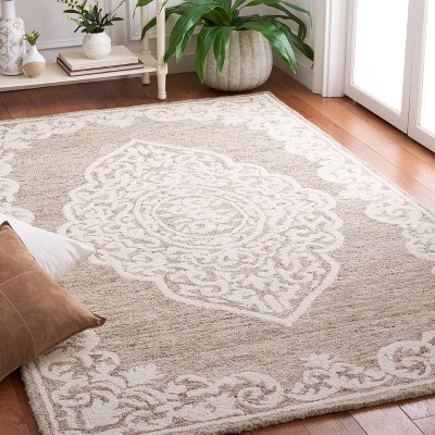Handmade Ivory Abstract Tufted Wool Round Rug