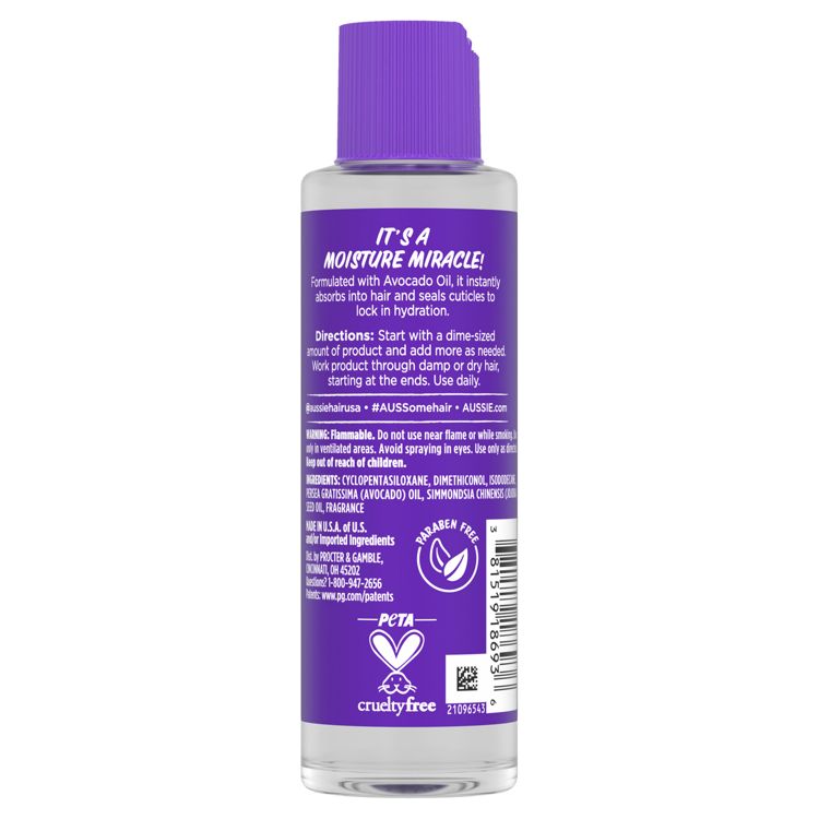 Clear bottle of hair oil with a purple colored label and purple colored cap; label reads 'IT'S A MOISTURE MIRACLE!' and includes directions, ingredients and a cruelty-free logo.