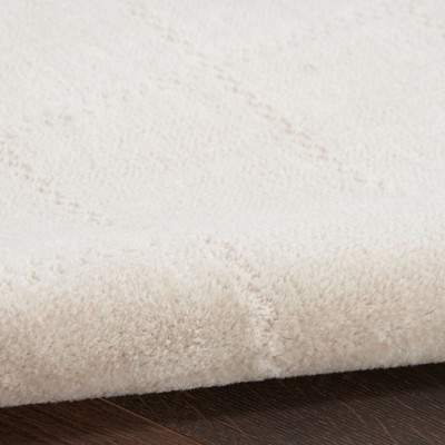 Ivory Cream Geometric 10' x 14' Synthetic Area Rug