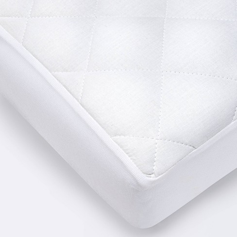 Waterproof Fitted Crib and Toddler Mattress Pad Cover - Cloud Island™ White - image 1 of 3