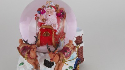 Santa Claus on Sleigh with Reindeer Musical Christmas Snow Globe