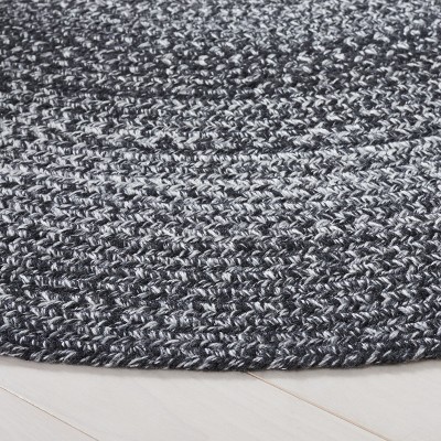 Handmade Black and Ivory Braided Round Synthetic Rug, 4' Diameter