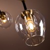 ALOADECOR 7-Lights Black and Brass Modern Linear Sputnik Chandelier With Clear Glass Shade - 4 of 4