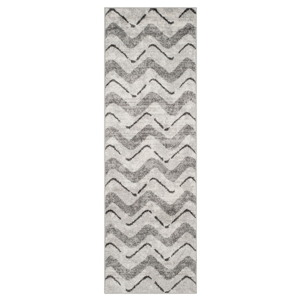 2'6 x8' Briarwood Adirondack Area Rug Silver/Charcoal - Safavieh Inspired by global travel, the bold colorful motifs and alluring patterns, Briarwood Adirondack Area Rugs translate rustic lodge style into supremely chic, easy-care floor coverings. Made using enhanced polypropylene yarns, Briarwood rugs explore stylish over-dye and antiqued looks, making a striking fashion statement in any room. Safavieh translates rustic lodge style into the supremely chic and easy-care collection. The Briarwood Collection is power loomed using soft yet durable enhanced polypropylene yarns for a comforting feel underfoot and lasting beauty.   Size: 2'6 X8' RUNNER. Color: One Color. Pattern: Chevron.