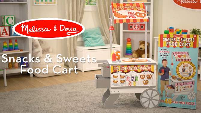 Melissa &#38; Doug Wooden Snacks and Sweets Food Cart - 40+ Play Food pc, Reversible Awning, 2 of 18, play video